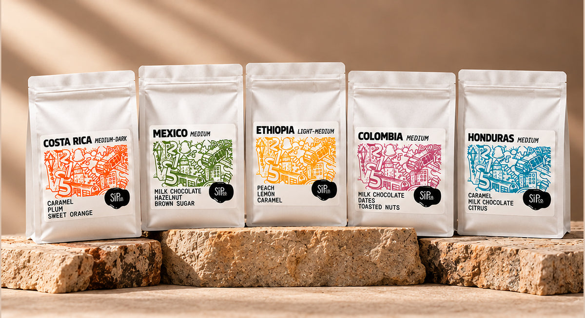 Five SiPco single-origin coffee bags on stone pedestals: Costa Rica, Mexico, Ethiopia, Colombia and Honduras